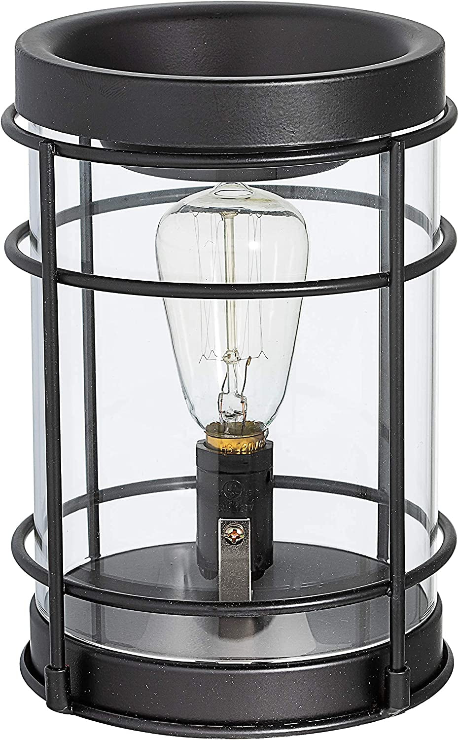 Lamp candle warmer glowing softly over a scented jar candle on a wooden nightstand